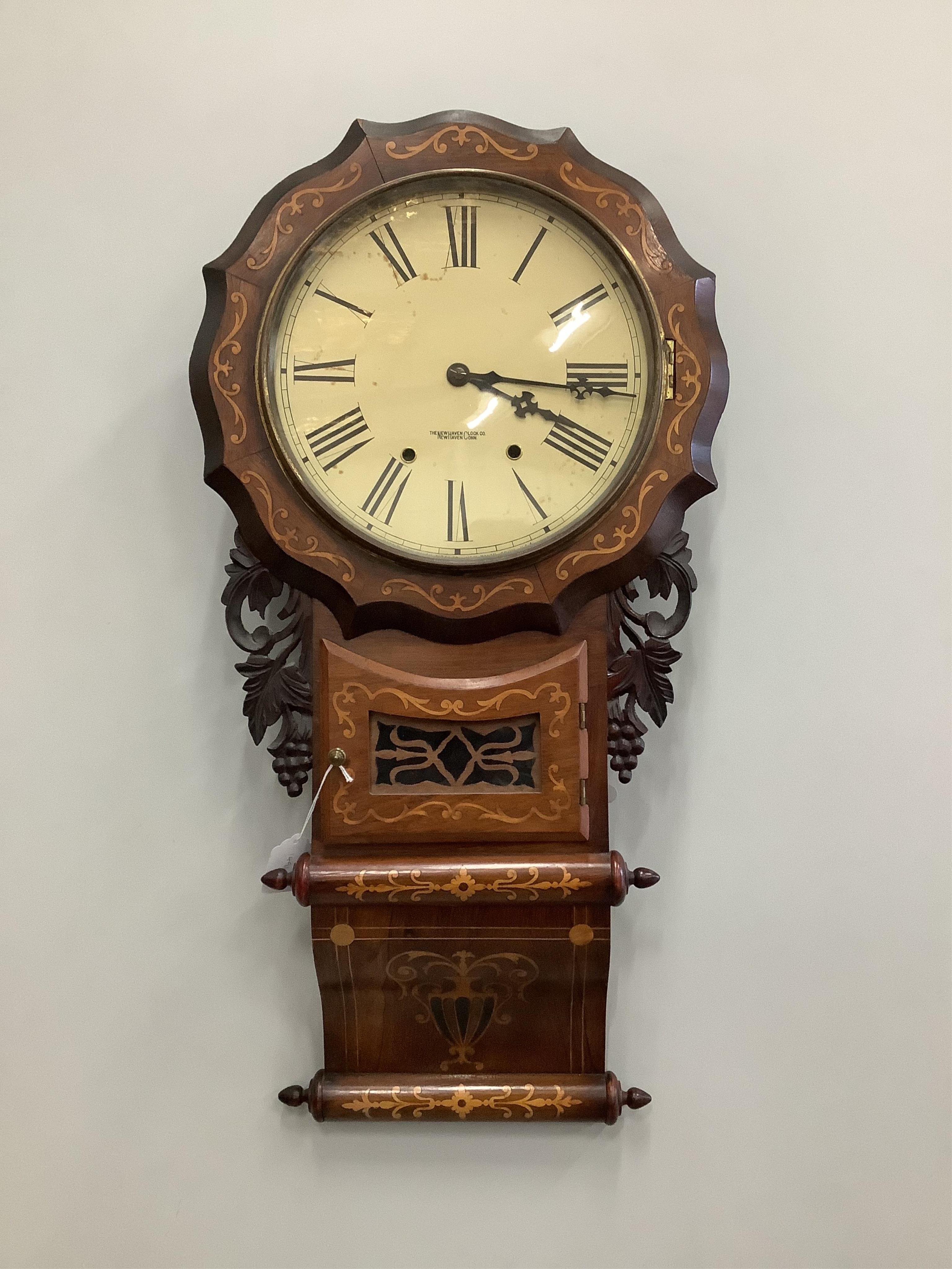 A late 19th century Newhaven Clock Company rosewood and marquetry inlaid drop dial wall timepiece, height 80cm. Condition - fair